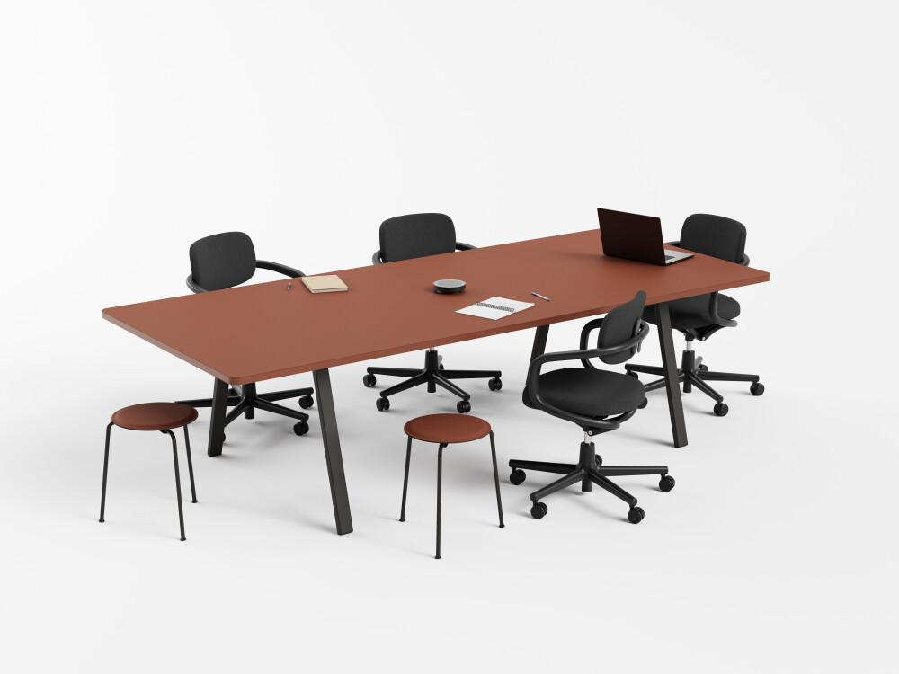 Black DIN Plus office desk with oak edge and black rectangular metal frame, furnished with monitors and chairs.