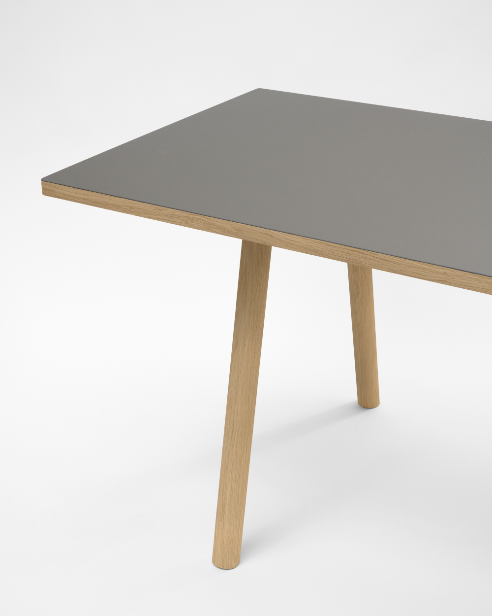 Round DIN PLUS table leg by Faust, made of wood with grey linoleum tabletop against a white background.