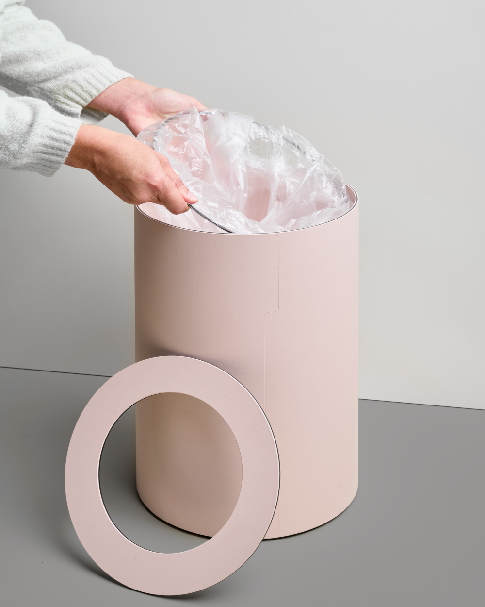 Faust TIDY Paper Bin in rose, cylindrical waste bin with detached ring cover, shown with inserted plastic bag.