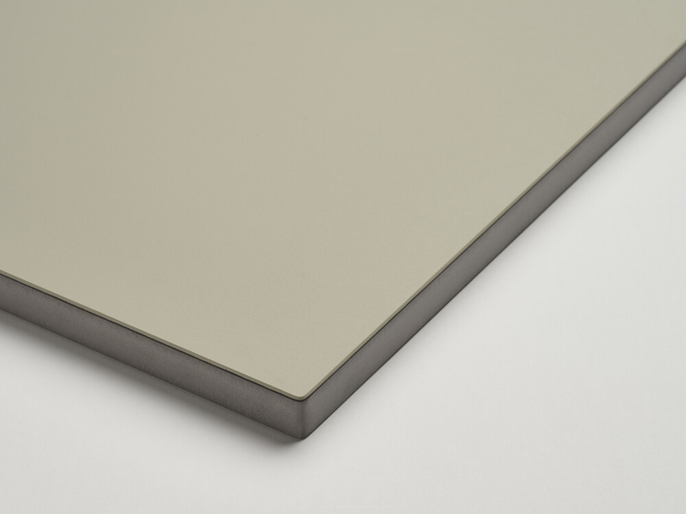 Studio shot of a Faust table top with matt linoleum surface in burgundy and color-coordinated MDF edge in mouse grey.