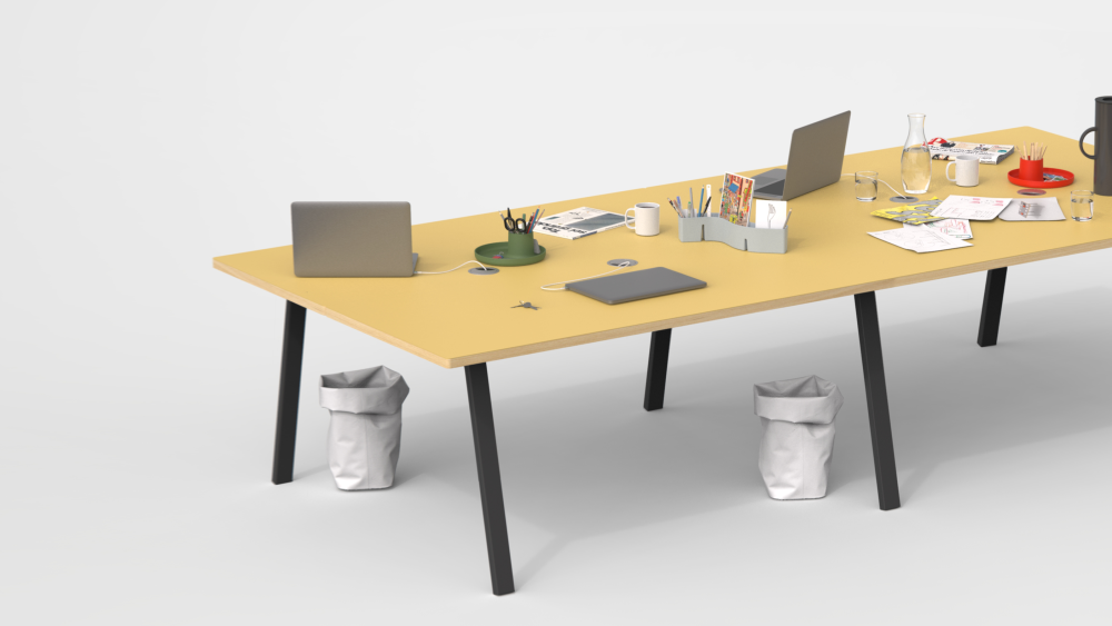 A spacious tabletop in Pure Linoleum with a wooden edge, supported by angled black metal DIN legs designed by Michel Charlot. It accommodates four workstations, equipped with cable management and featuring essential office items, creating an organised and