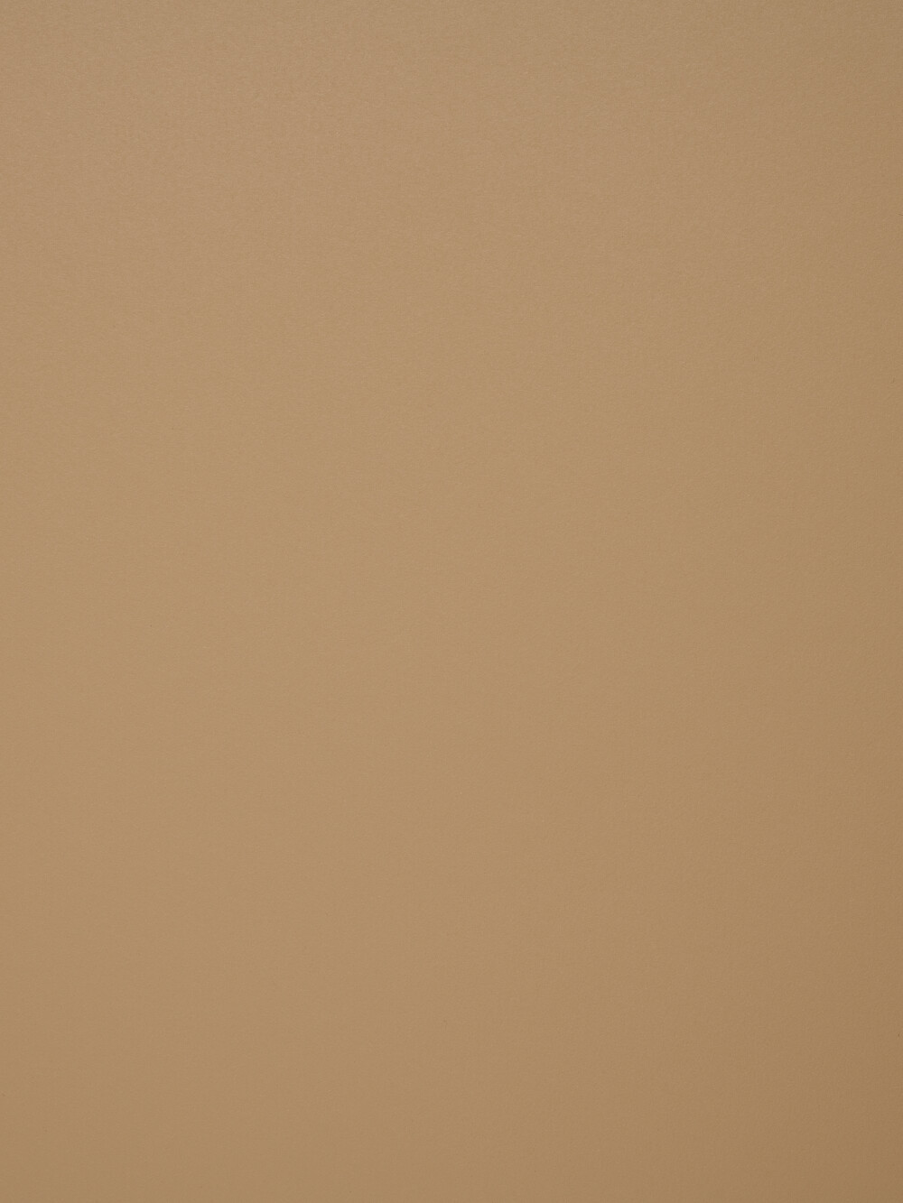 Linoleum-Oberfläche in Walnut – warme, matte Braunfläche mit feiner Textur, gezeigt als Materialdetail einer Tischplatte von Faust.