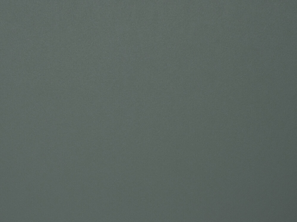 Linoleum-Oberfläche in Pewter – matter, fein texturierter Belag in dunkelgrau-grünem Ton, dargestellt als Detail einer Faust-Tischplatte