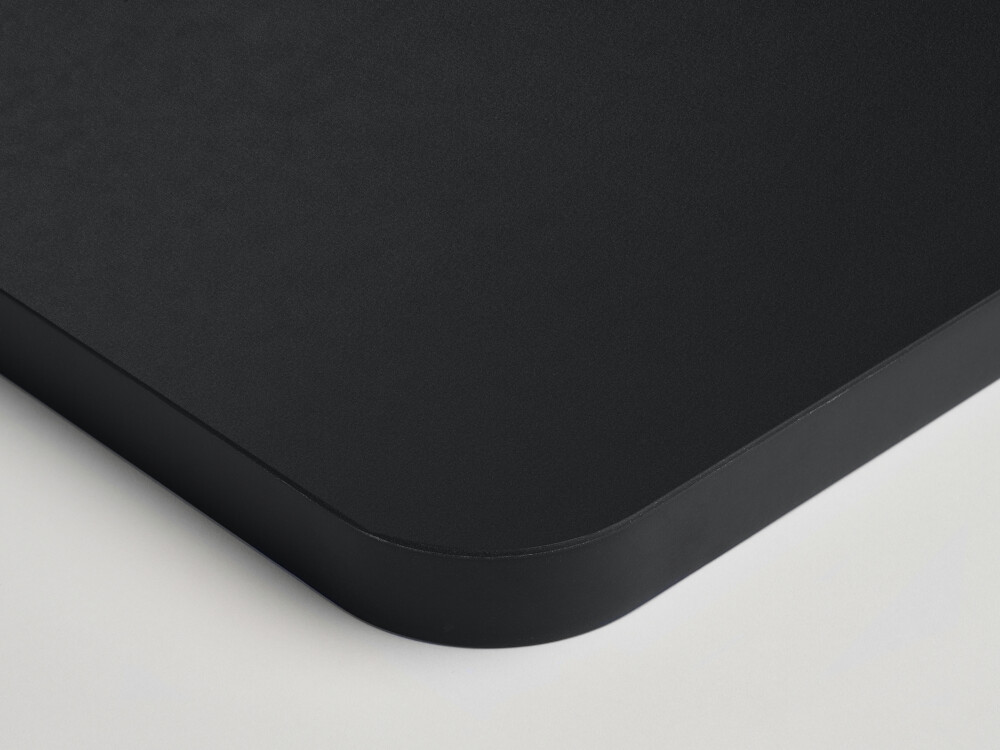 Fist table top in black (Nero) with matt linoleum surface and round linoleum edge in the same color.