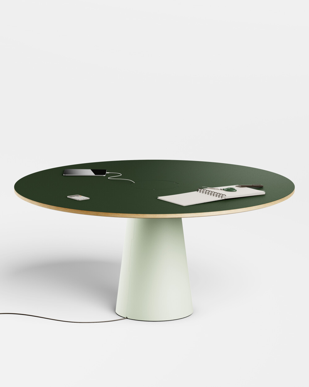 Round ALT desk by Faust with dark green top and light-coloured base, equipped with cable management.