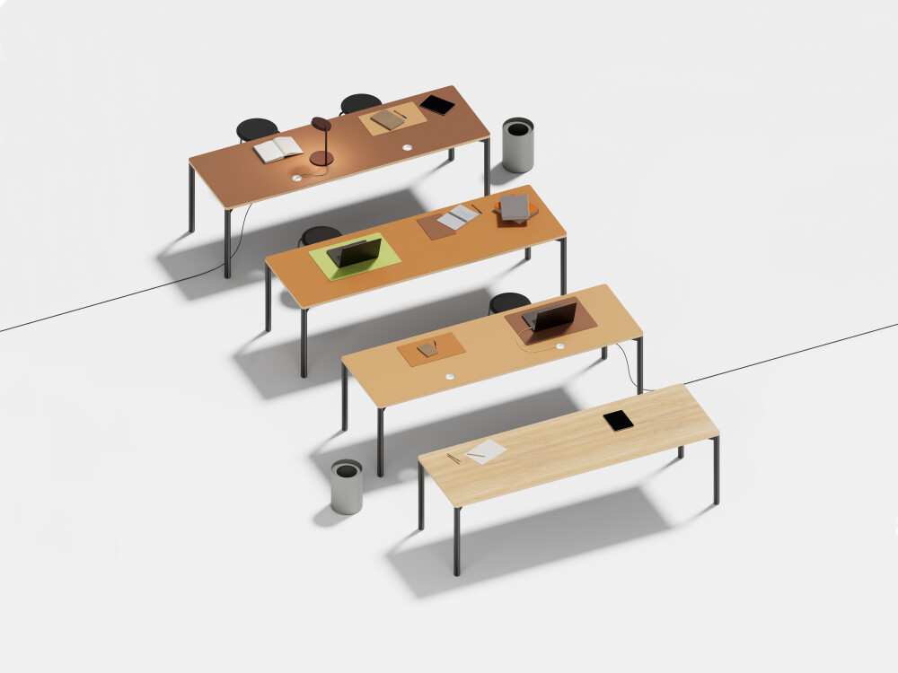 Four Outline desks by Faust with warm linoleum surfaces, each with a black frame, shown in various setups.